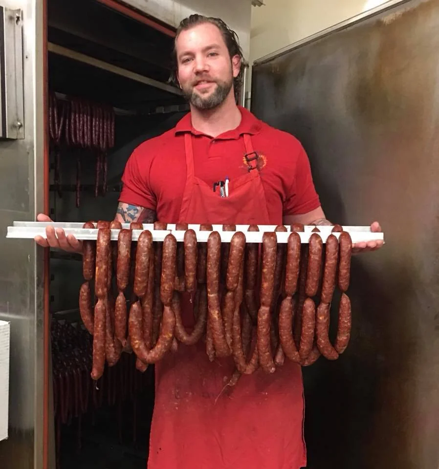 Adam Kelly working at the sausage rack at Jaworski Meats — the kind of content he posts to Butcher's Lounge Live