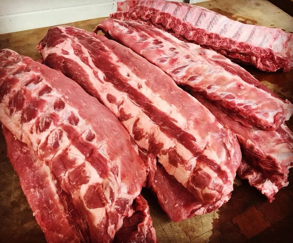 Fresh baby back ribs at Jaworski Meats, hand-cut pork ribs ready for the grill